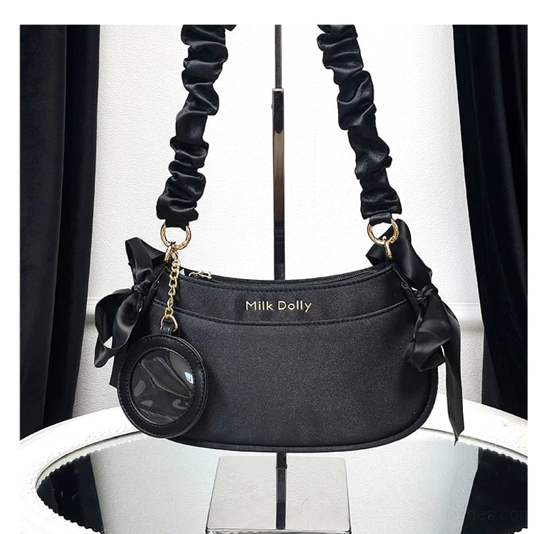 Convertible mini ita bag feature showcase displaying detachable top handle and adjustable crossbody strap options for versatile wearing styles and occasions