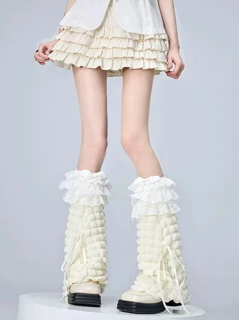 Cream colored jirai kei lolita calf socks with delicate ruffled lace trim and bow details paired with matching sock covers for voluminous aesthetic