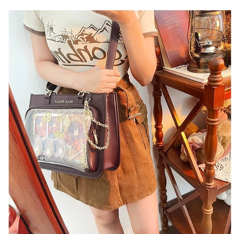 Checkered ita bag front window clarity demonstration showing crystal-clear anime character printing visibility