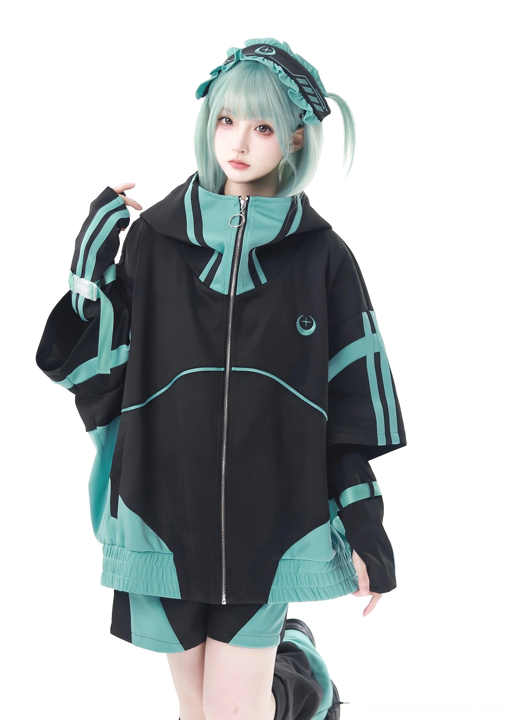 Single model teal-haired female wearing black-teal Jirai Kei short sleeve zip jacket front closure wrist cuffs contrast panels studio front view