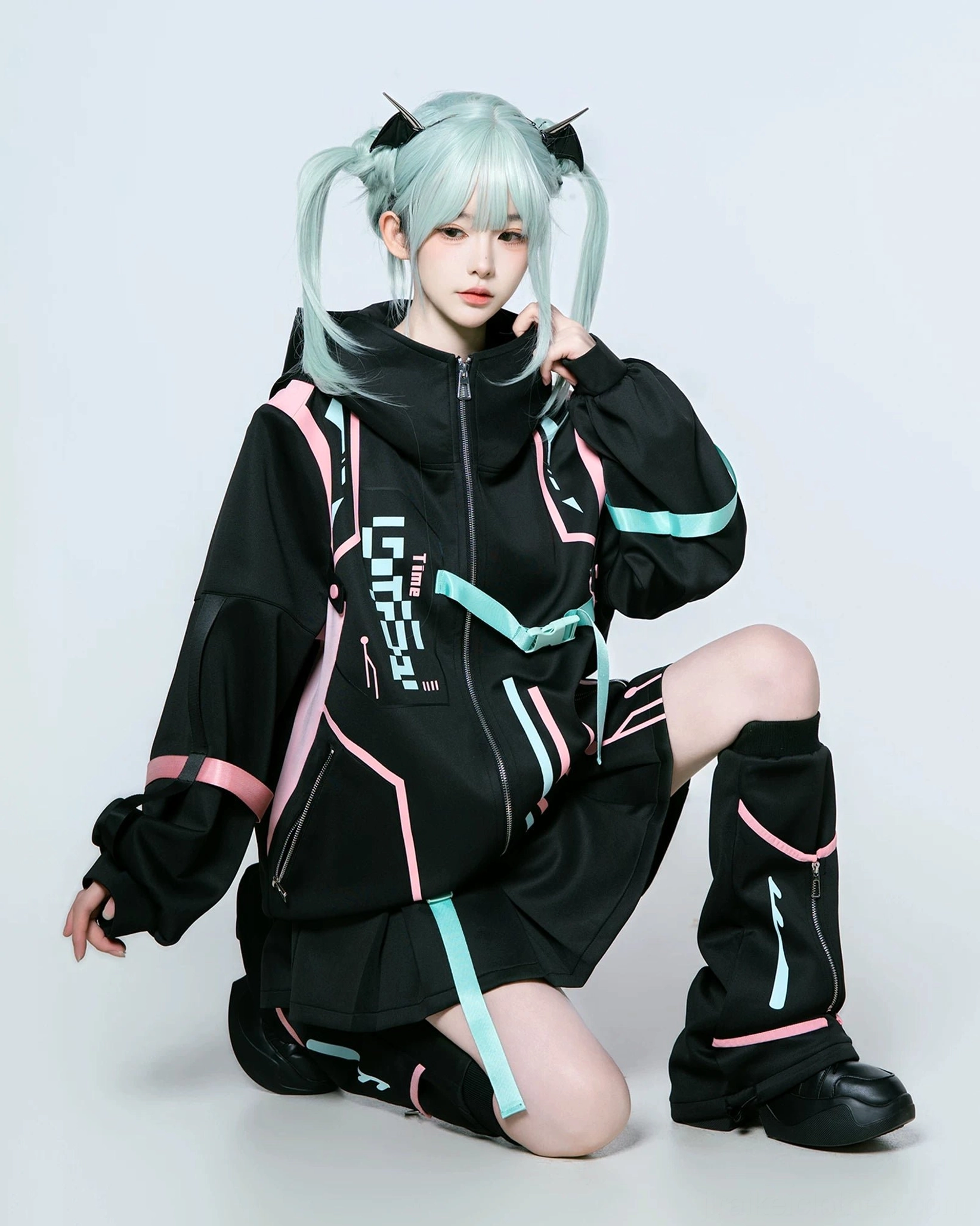 Cyberpunk Jirai Kei techwear jacket and coordinating pleated skort with full set of striped leg warmers, displaying air layer fabric breathability and lightweight construction