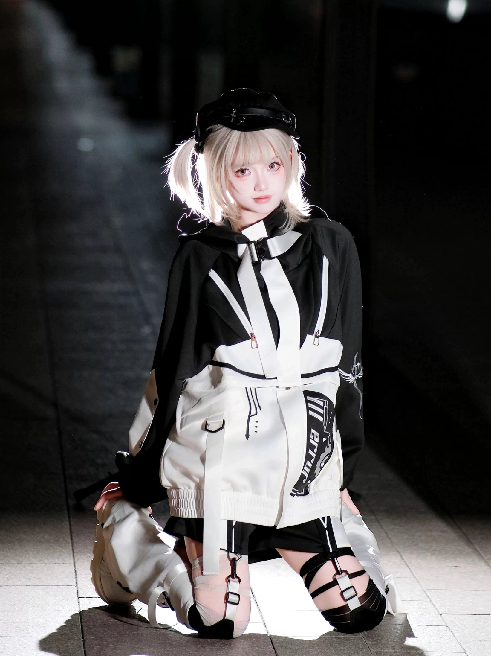 Cyberpunk jirai kei jacket strap detail showing functional attachment points modular system close-up photography