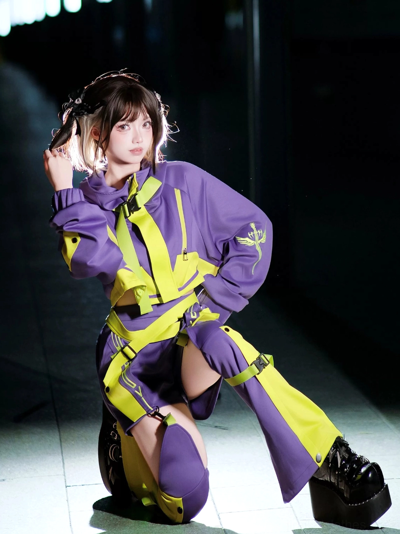Purple yellow cyberpunk jirai kei hoodie set with strap harness details matching leg guards and platform boots on model kneeling pose