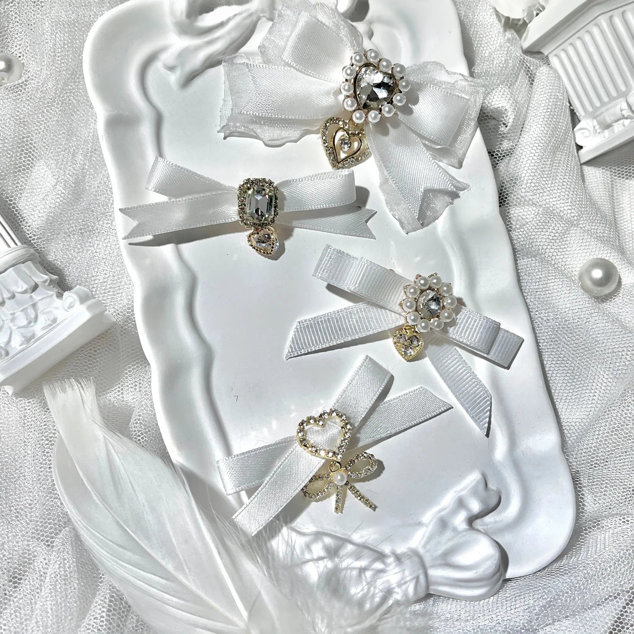 Jirai Kei bow hair clips detail shot showing rhinestone pearl embellishment craftsmanship and ornate decoration close-up view