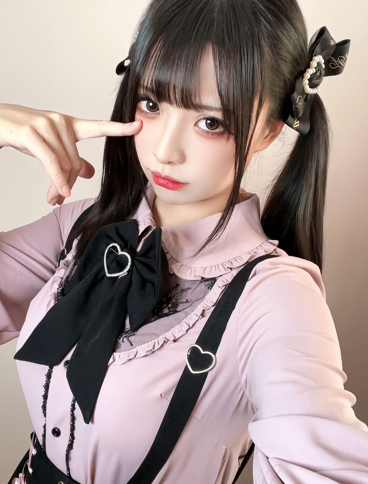 Full-length view of Jirai Kei suspender skirt highlighting adjustable shoulder straps, double-layered ruffled construction, and black lace-up waist elastic band