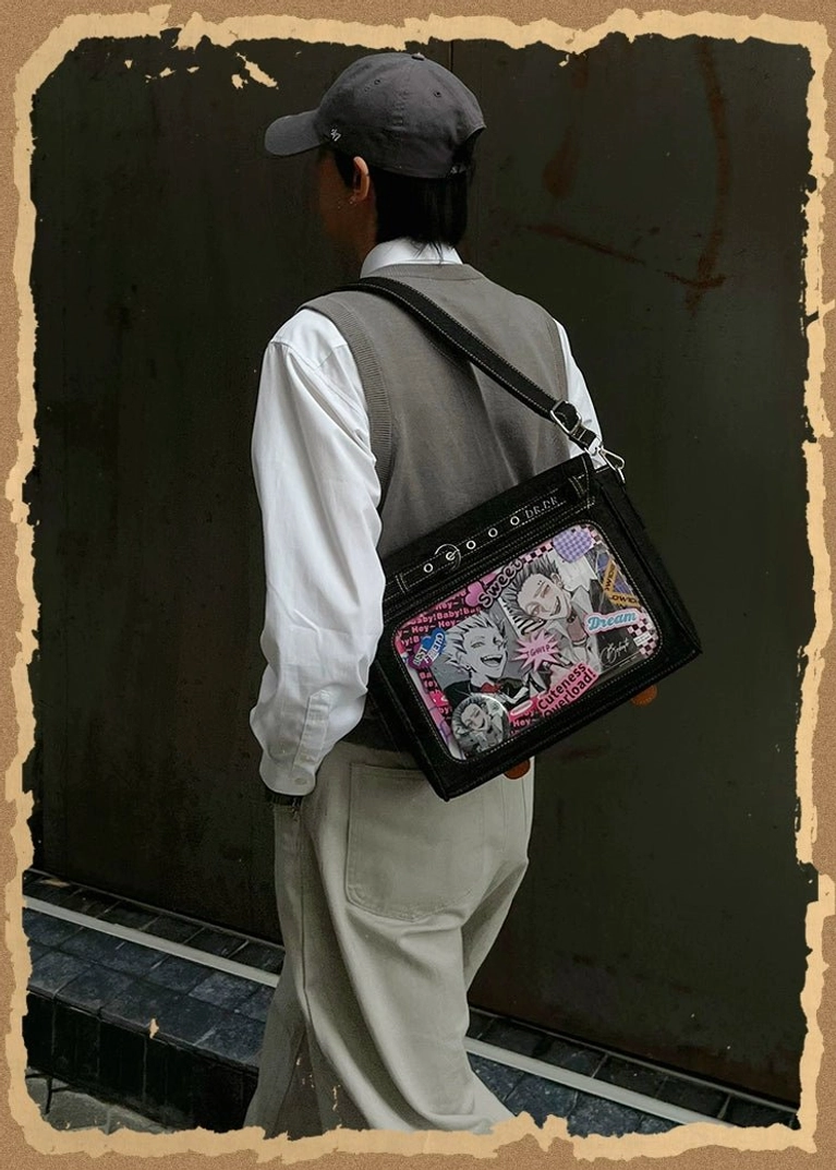 Denim itabag crossbody bag worn at anime convention event showcasing collectible pins and acrylic keychains displayed in transparent PVC window