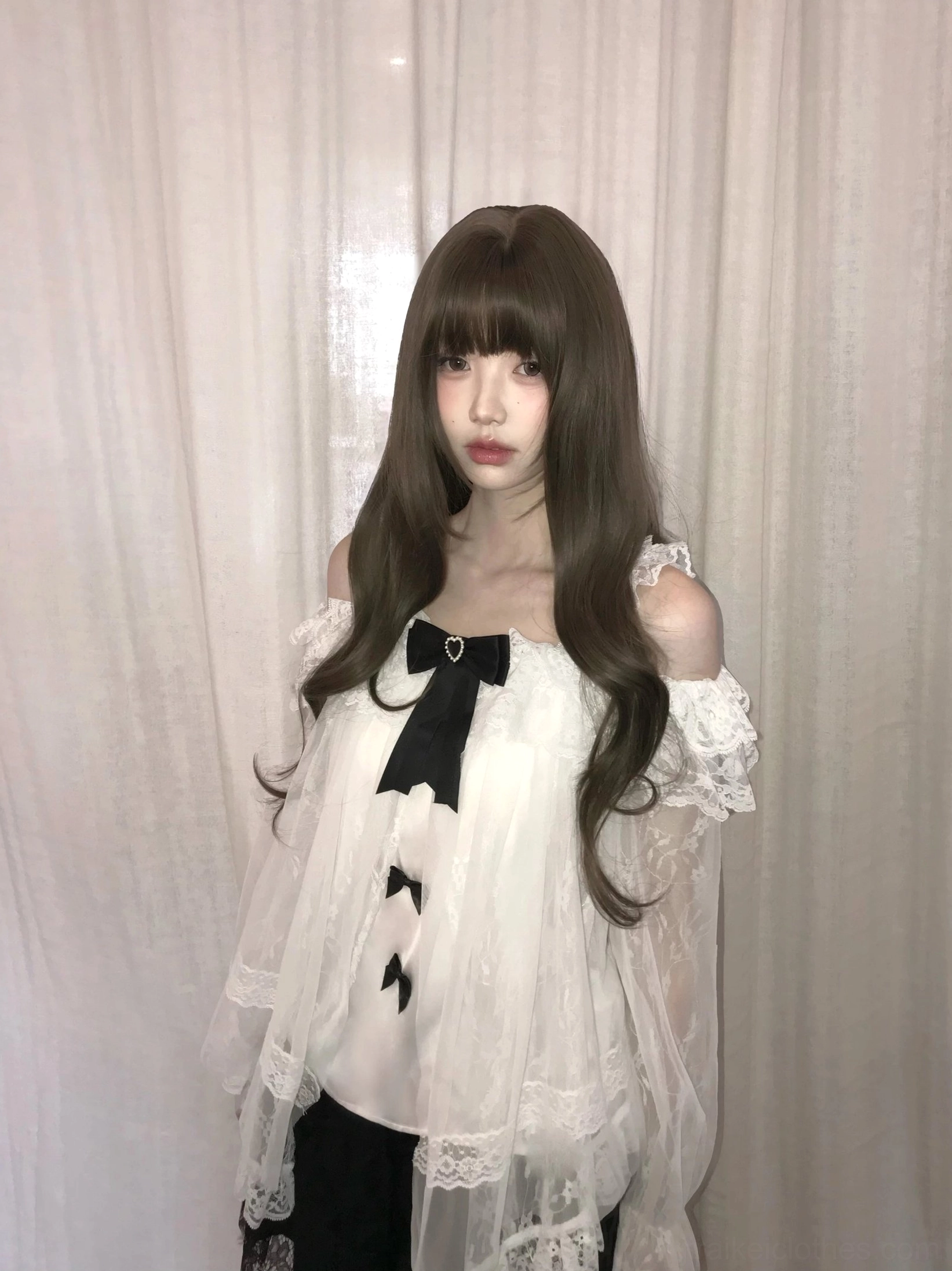 Detail view of removable black satin bow collar decoration on off-shoulder blouse, demonstrating detachable design feature for styling versatility in Jirai Kei fashion