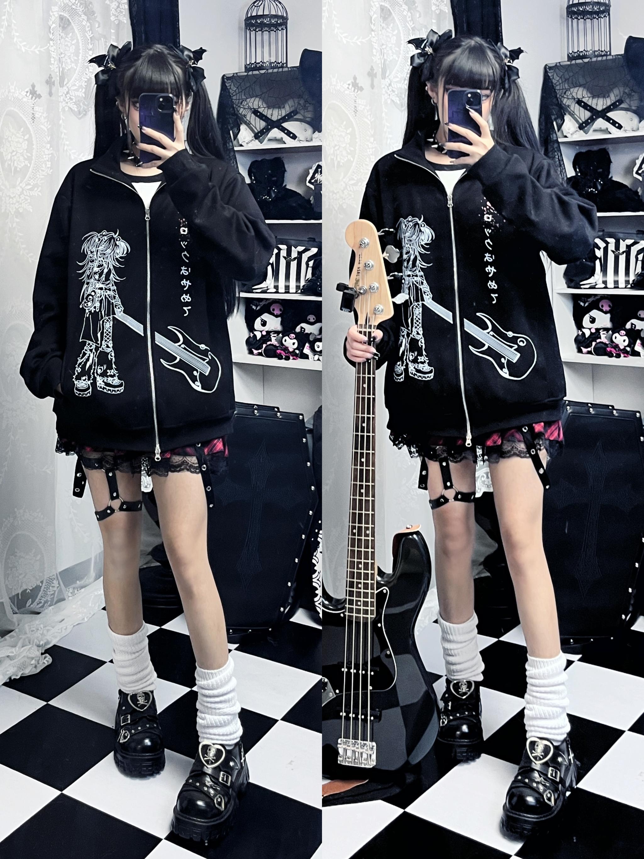 Dual-side mirror shot showing two female goth models in matching Jirai Kei oversized zip hoodies with identical poses on checkered floor