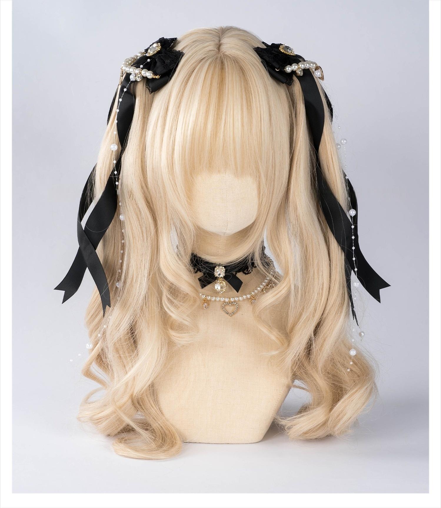 Jirai Kei black bow hair clips with pearl chain trim and rhinestone heart accent displayed on mannequin head with twin-tails hairstyle and coordinating black choker