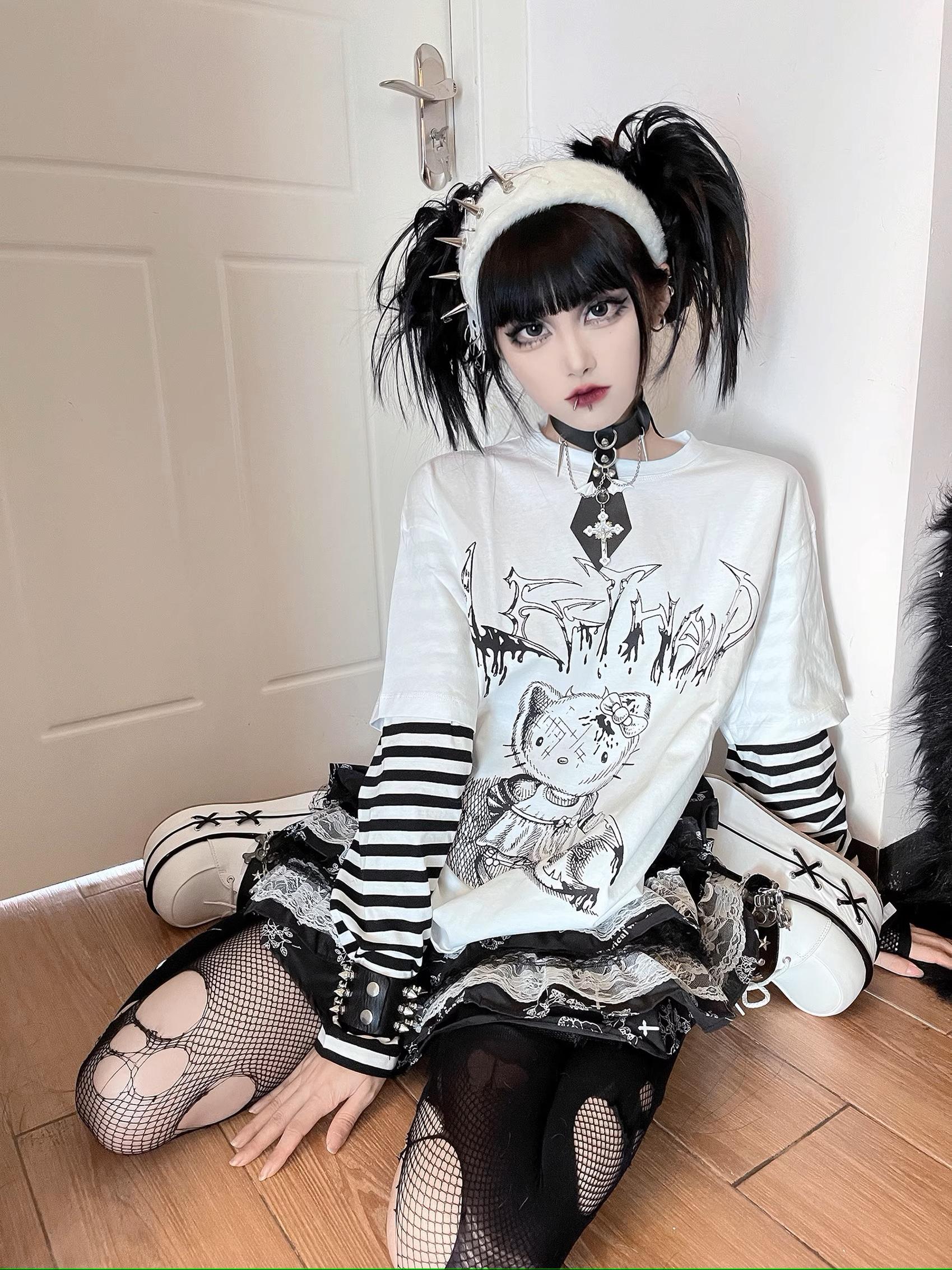 Alternative angle of jirai kei fake two-piece long sleeve tee with anime character graphic print and striped sleeve design
