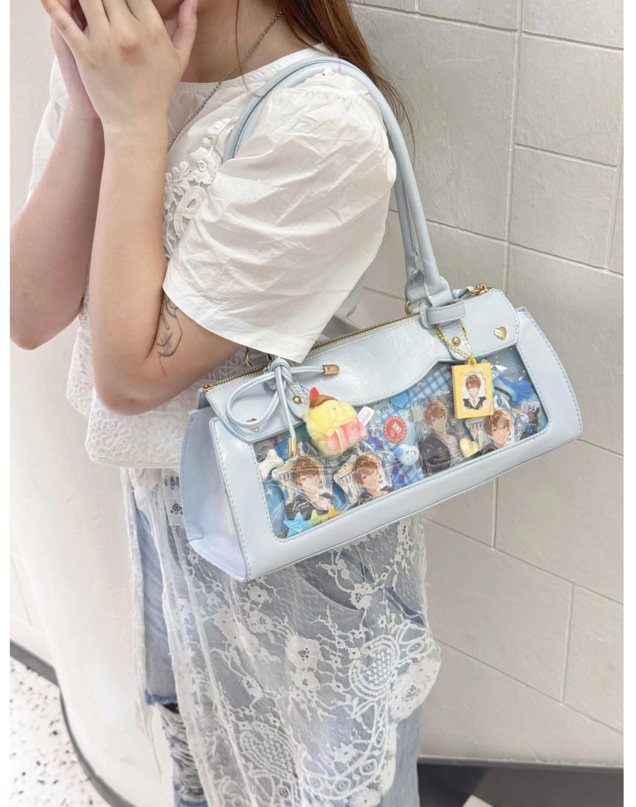 Baguette itabag interior pocket organization and badge arrangement system for collectible management