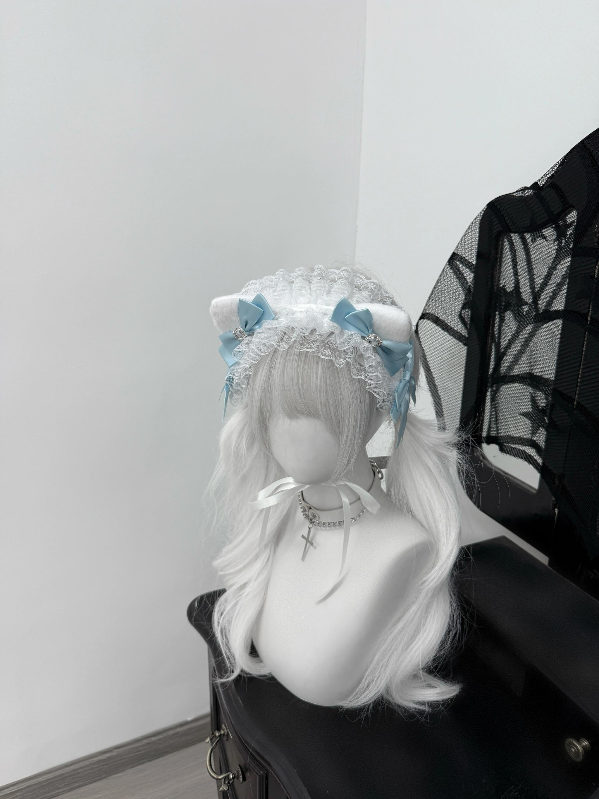 Fluffy cat ear jirai kei headband with rhinestones and satin ribbon bows left angle detail view