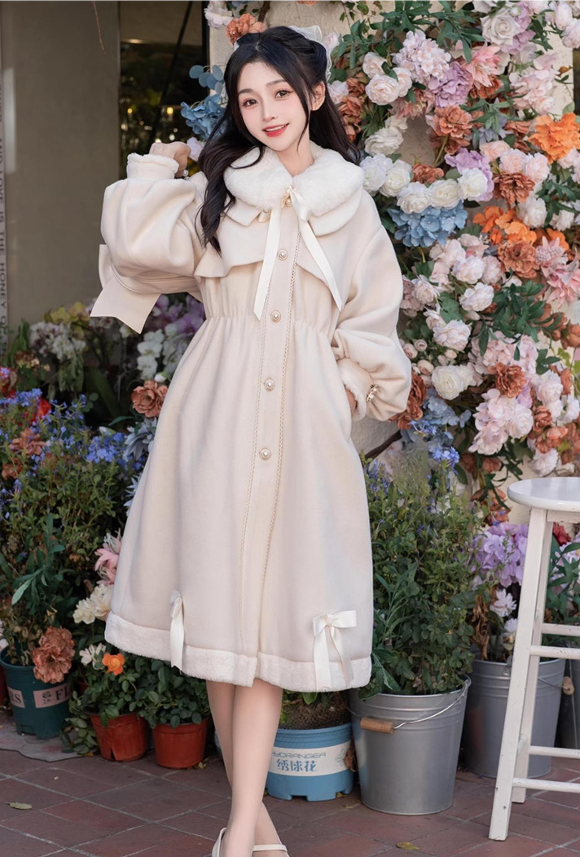 Beige Ryousangata Jirai Kei winter coat side profile - female model in light neutral coat with button front, gathered waist, and plush hem bow trims at flower shop setting