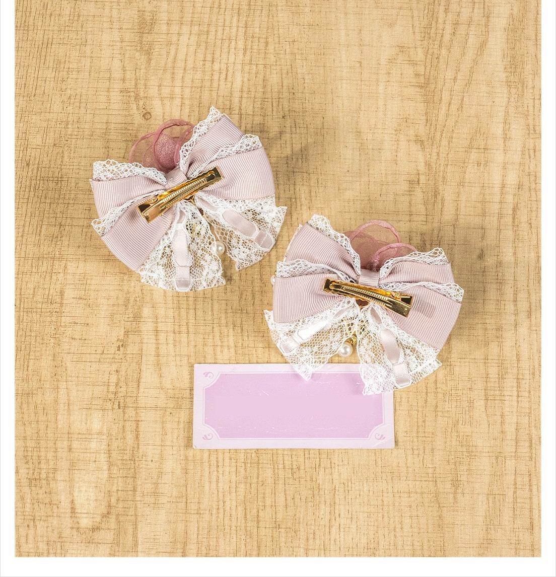 Pair of apricot mini bow hair clips with rhinestone heart pendant Jirai Kei aesthetic style