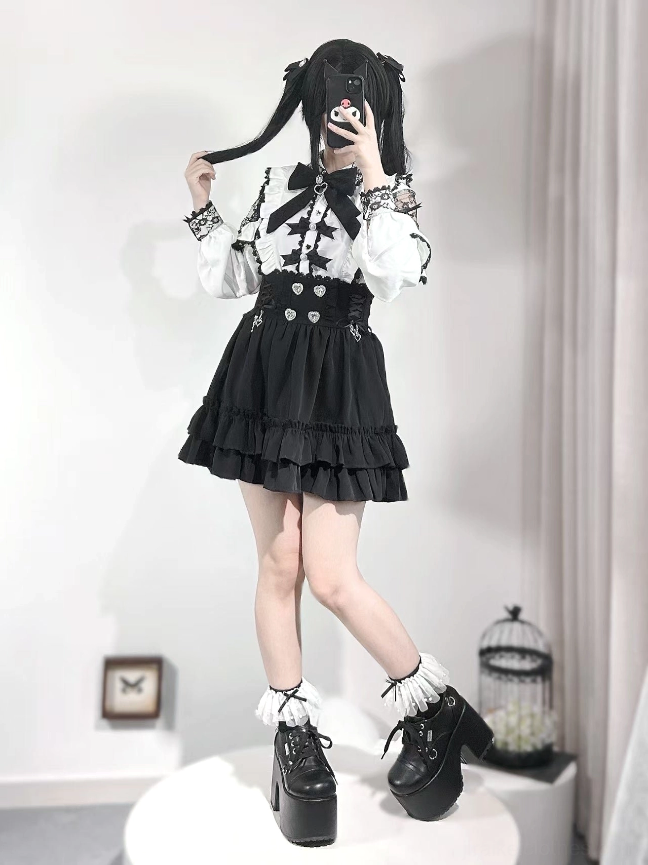 Complete Jirai Kei coordinate full-body view showing white off-shoulder blouse paired with black ruffled skirt, platform boots, and layered lace socks