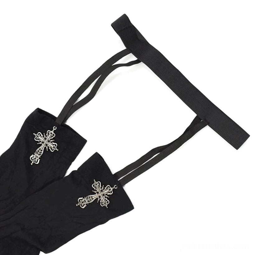 Flat lay product shot of garter strap accessory sets with black elastic straps and silver cross charms on plain white background