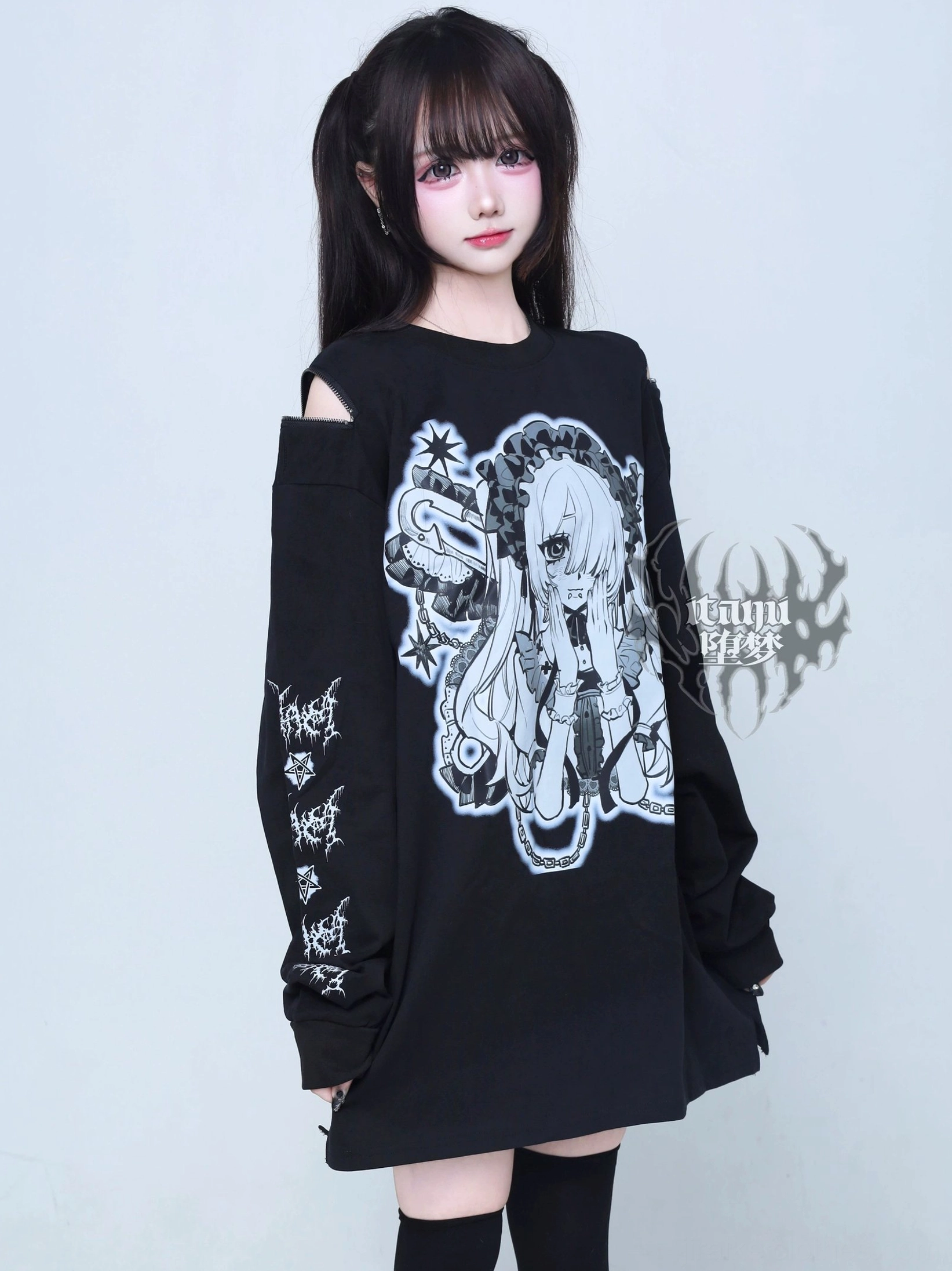 Right three-quarter view gothic anime graphic long-sleeve tee large blue-white chest print sleeve patterns exposed shoulder