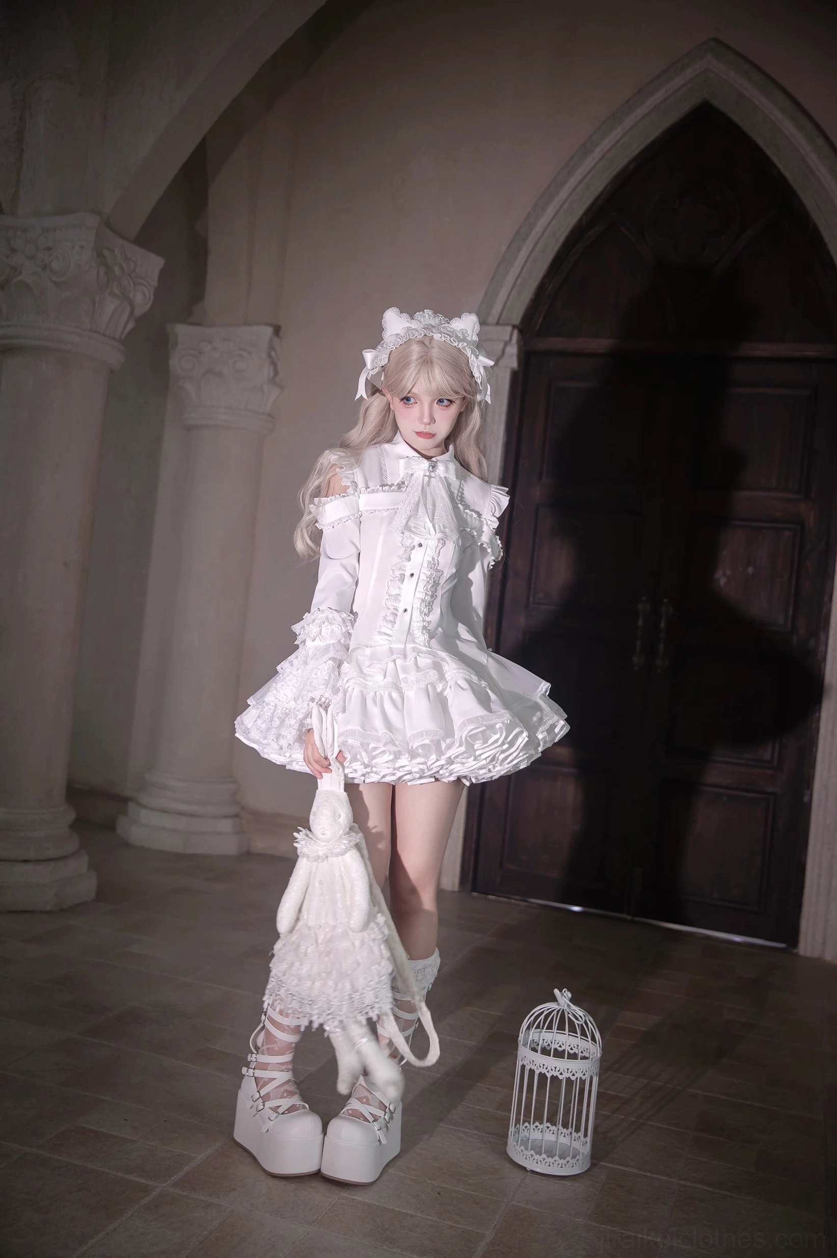 Gothic lolita two-piece set three-quarter side body view showing fitted ruffled blouse and tiered lace mini skirt silhouette