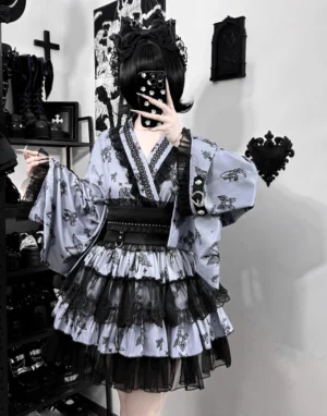 Gray-black gothic yukata wing-print ensemble with black ruffled tiered skirt and dramatic kimono silhouette, front selfie styling in dark themed room