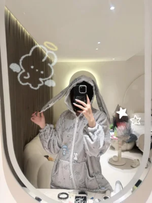 Gray-blue bunny ear hooded pajama set with cute cartoon prints and musical note design, mirror selfie in modern bedroom demonstrating relaxed fit