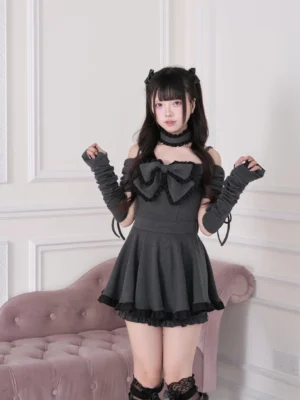 Gray off-shoulder ruffled mini dress set with large front bow and matching choker necklace with fingerless gloves, front full view pink sofa room
