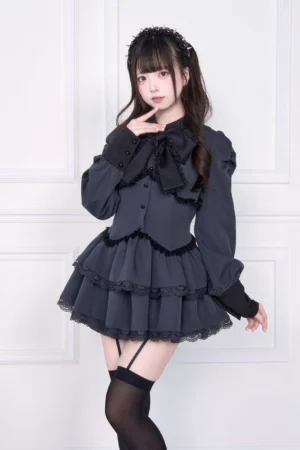 Dark gray charcoal Jirai Kei long-sleeved dress with black bow collar and ruffled layered skirt, close-up front view showing lace details and dress construction