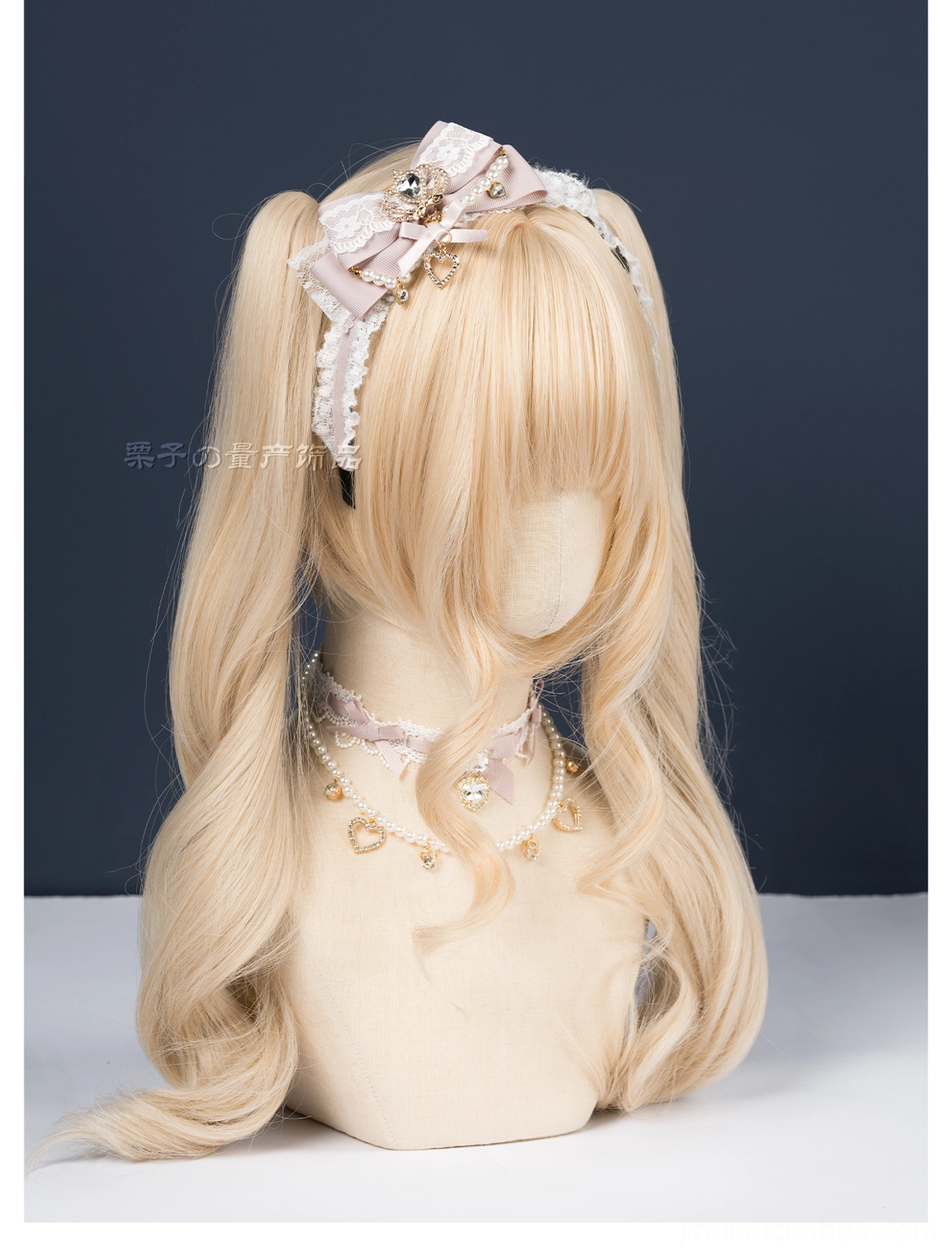 Grayish blue ryousangata plush bow headband three-quarter mannequin view cozy winter vibes dark backdrop