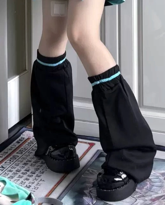 Green Tenshi Kaiwai Jirai Kei sport pants demonstrating nature-defiant aesthetic, toxic beauty theme, waistband design, and full-length silhouette
