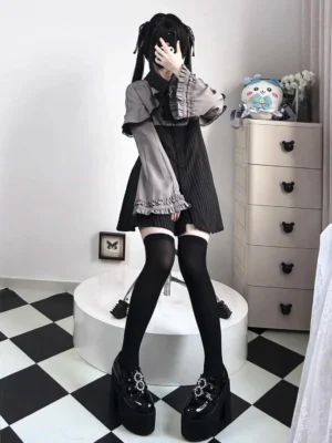 Grey and black contrast jirai kei two-piece dress with ruffled cuffs platform shoes checkered floor styling
