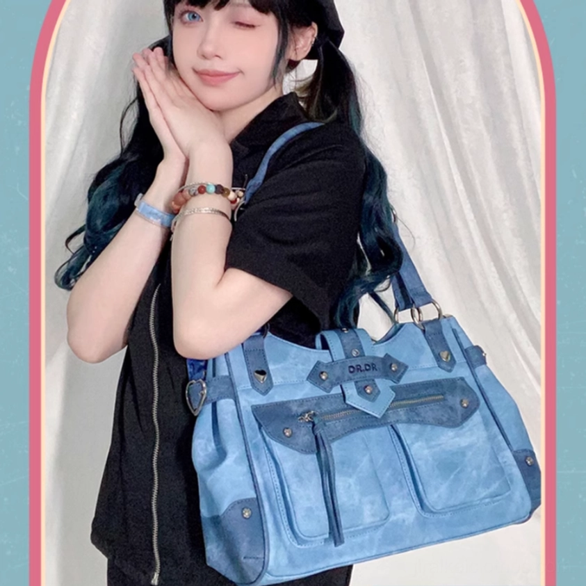 Gun-grey Jirai Kei ita bag front panel detailed closeup showing magnetic snap closure position and decorative element placement on surface