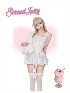Sweet halter neck gyaru dress with blue white floral print and coordinating bloomers styled with plush props and dessert accessories studio shot