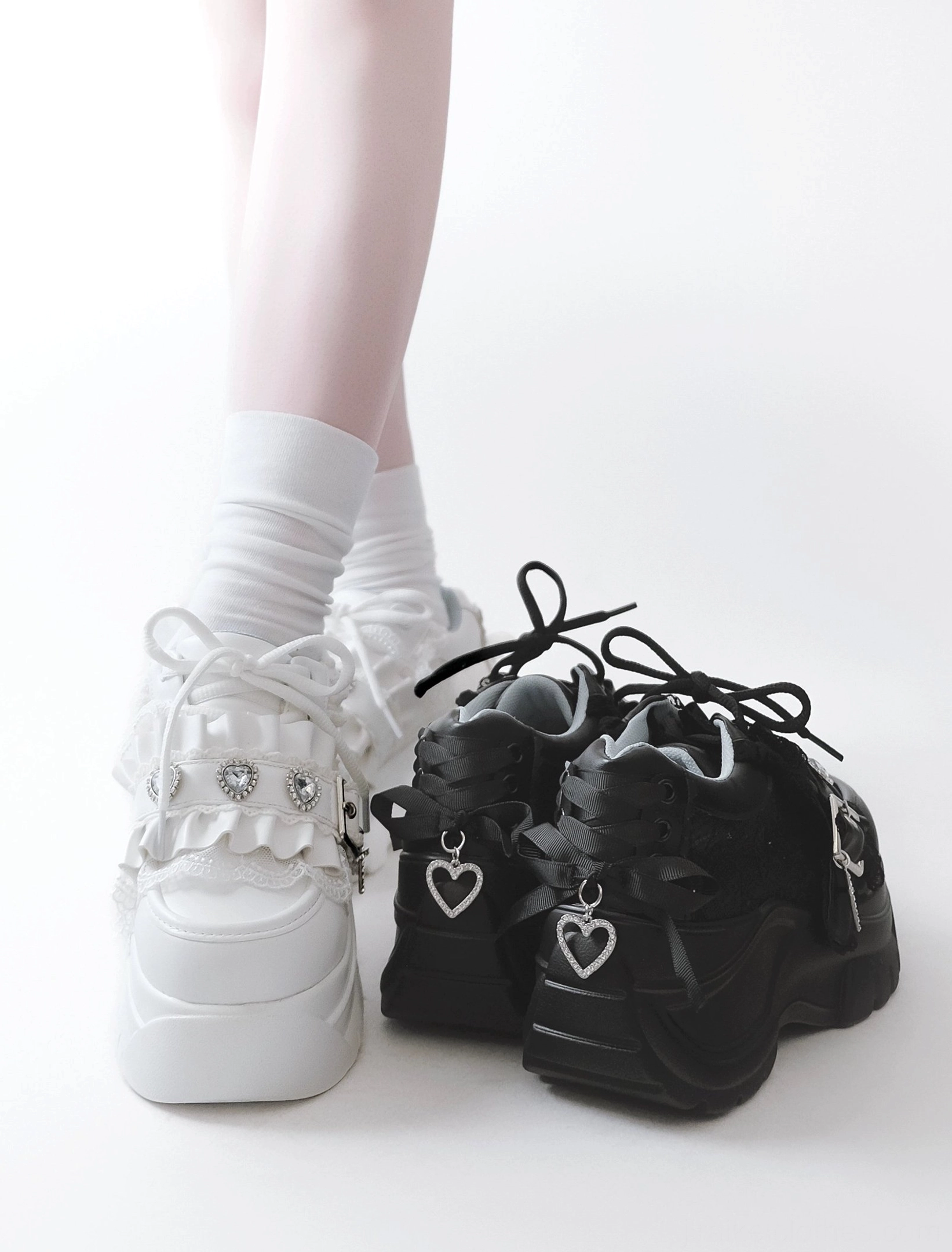 Jirai kei platform shoes rear view model feet wearing white color variant with black pair beside on white background