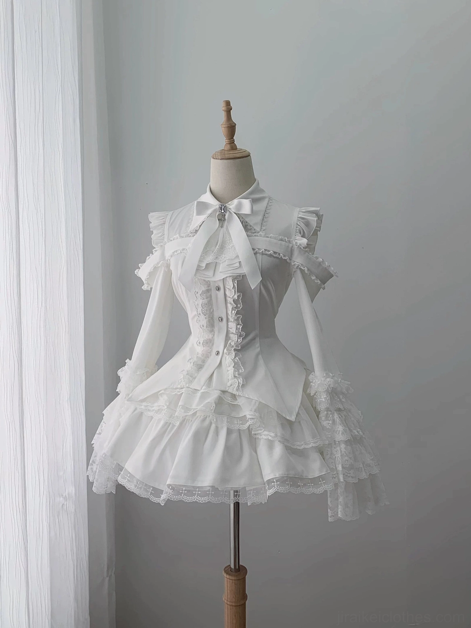 Mannequin display of hime sleeve blouse and lace skirt set front view showing bow neck detail and layered lace construction