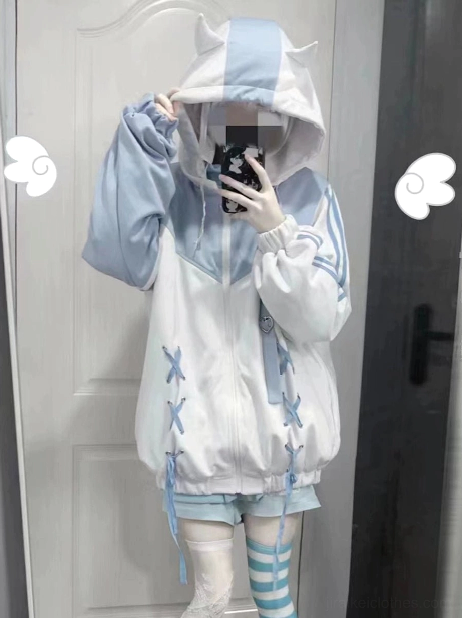 Hooded blue-white Jirai Kei sport jacket mirror front view showing cross-lace trimming, color-blocked panels, and loose oversized fit on model
