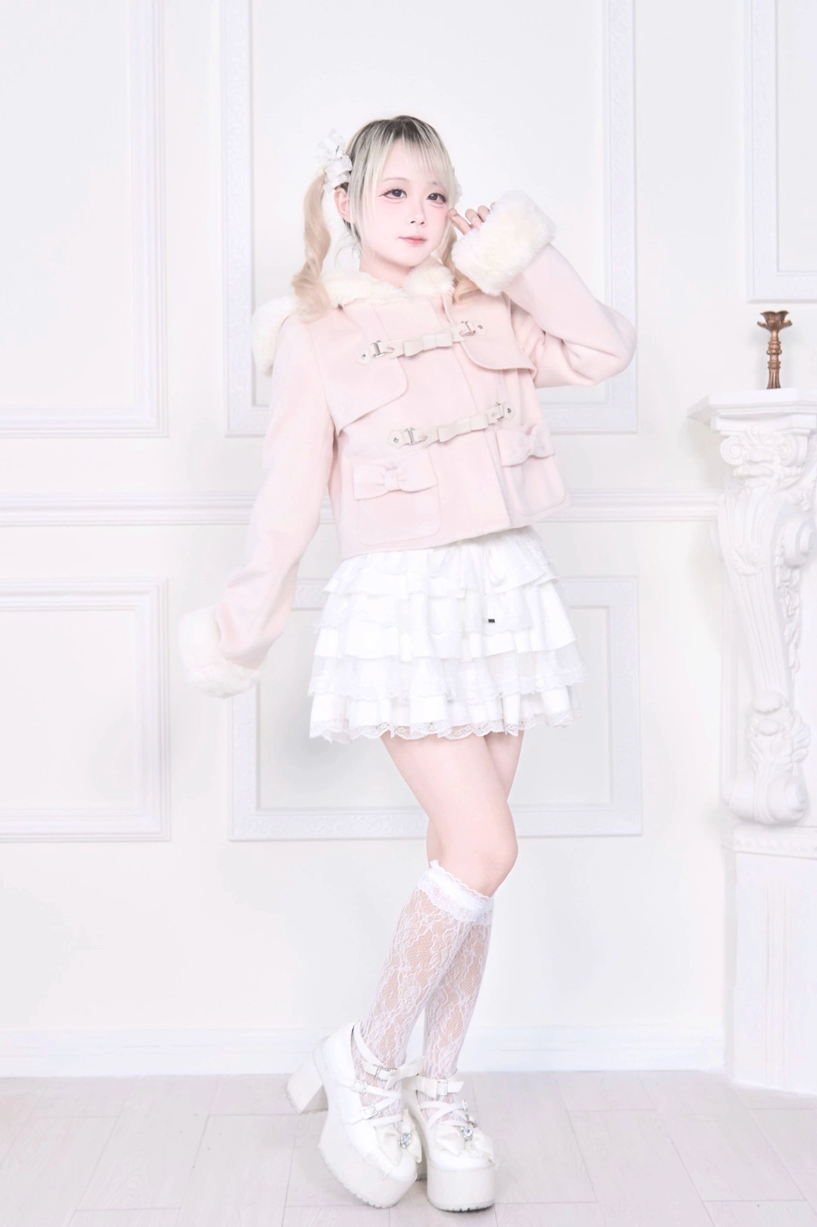 Hooded rousangata coat bow-adorned placket close-up, highlighting decorative bow accent detail and premium fastening of jirai kei coat front closure