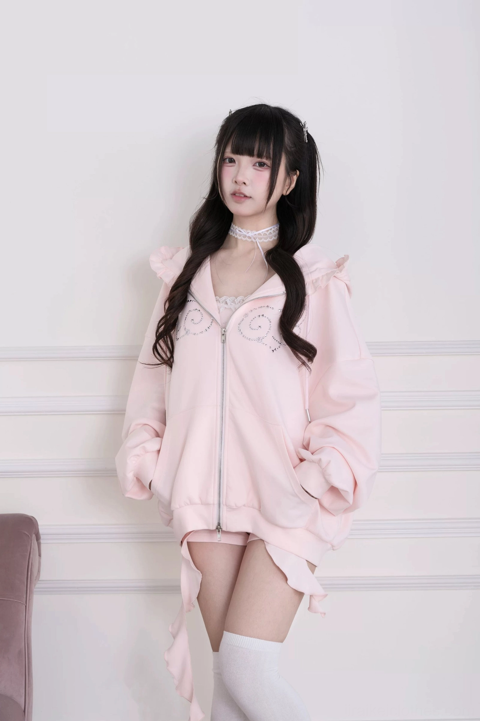 Hot-fix rhinestone embellishment close-up on angel wing hoodie jacket - Jirai Kei luxury sparkle accent detail