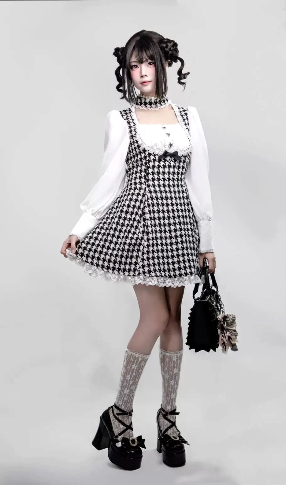 Full frontal display of houndstooth patterned Jirai Kei maid dress with integrated choker, showing square neckline, puffed sleeves, and lace trim construction across all sizes