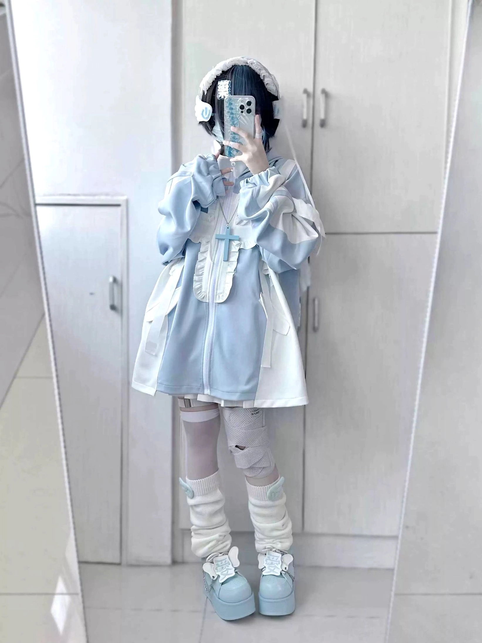 Close-up of jacket flounce trim on chest and shoulder area showing dimensional ruffle detailing on pastel blue tenshi coat