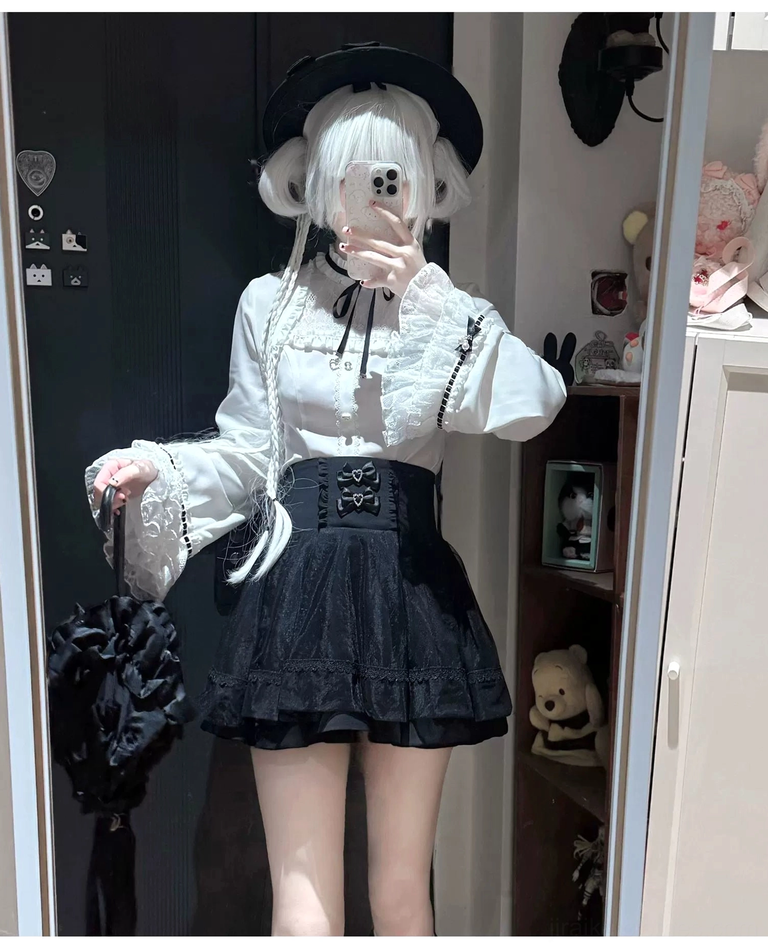Alternative angle of jirai kei two-piece ensemble highlighting the structured a-line skirt with double heart-shaped rhinestone bows and layered ruffled lace blouse design