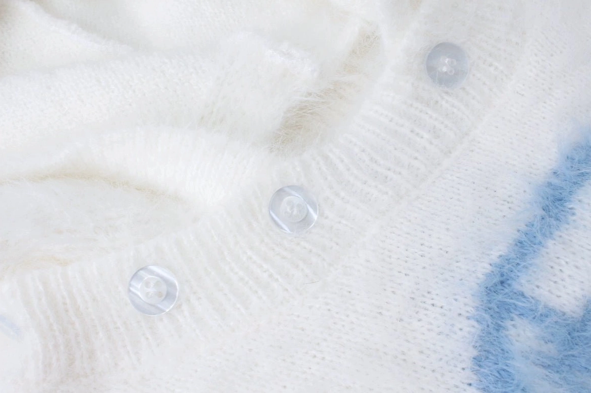 Jirai kei angel sweater bunny ear hood with wings design showing front embroidery star patches and geometric details