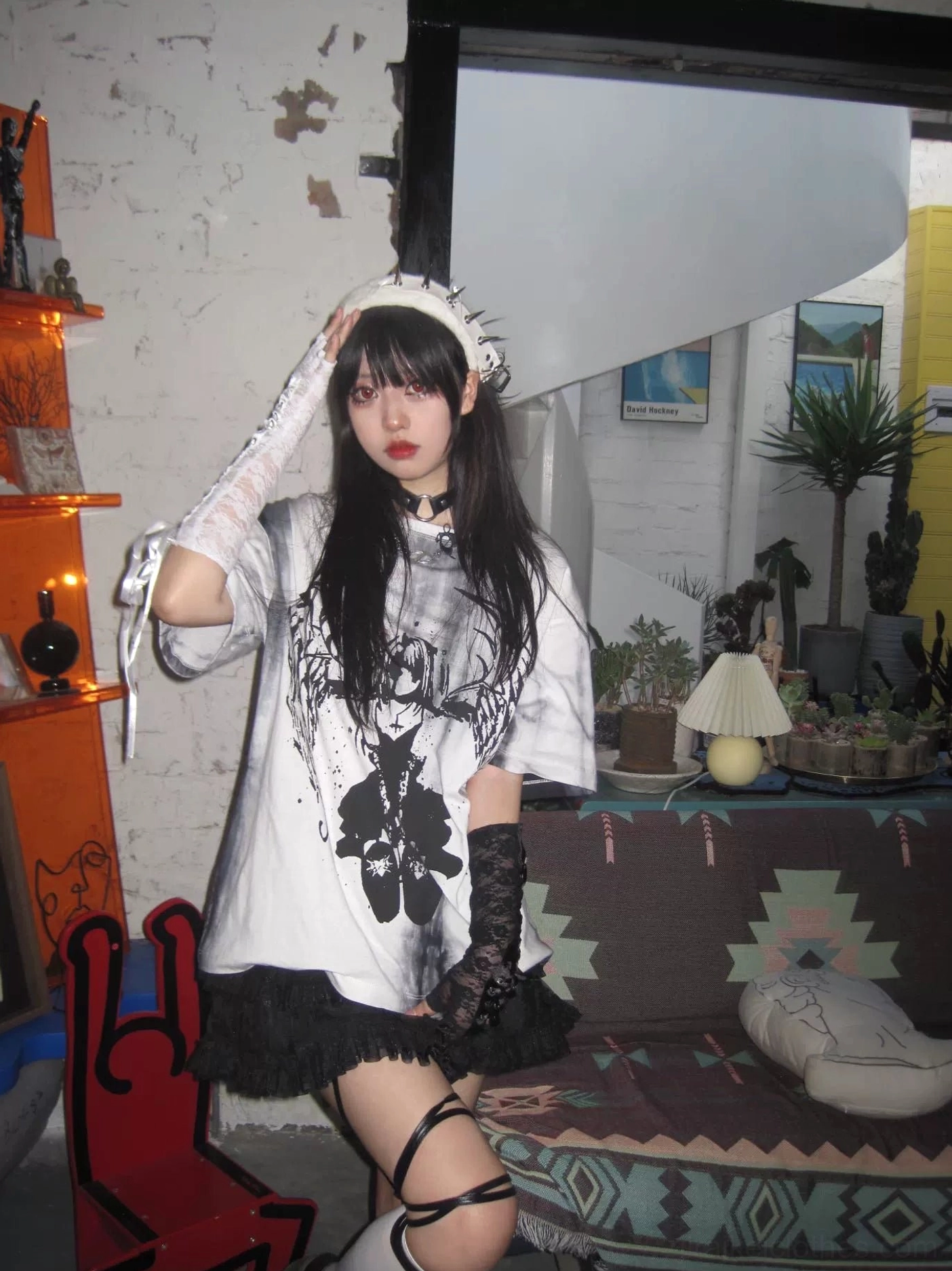 Lifestyle shot of celestial angel wings tie-dye gothic jirai kei t-shirt paired with alternative accessories and styling elements