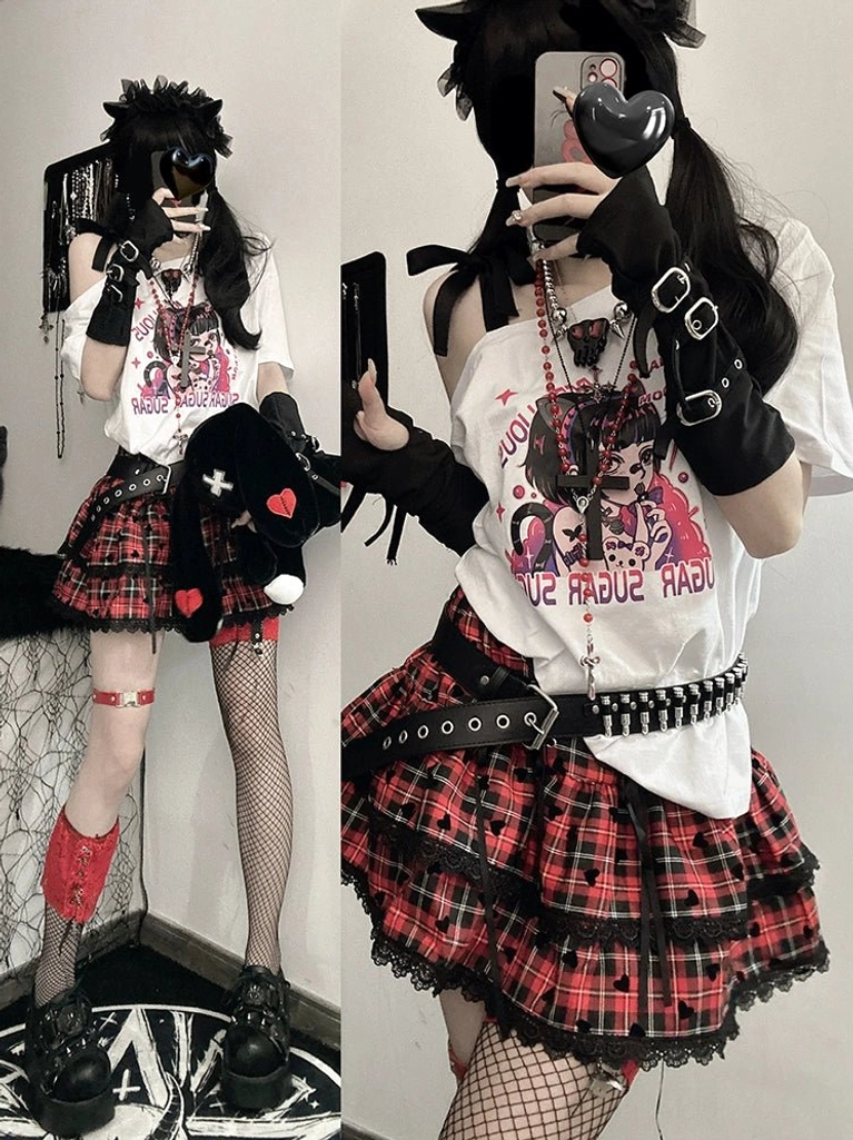 Product detail of black off-shoulder anime print tee showing graphic print placement, cold-shoulder cutout mechanism, and adjustable strap construction