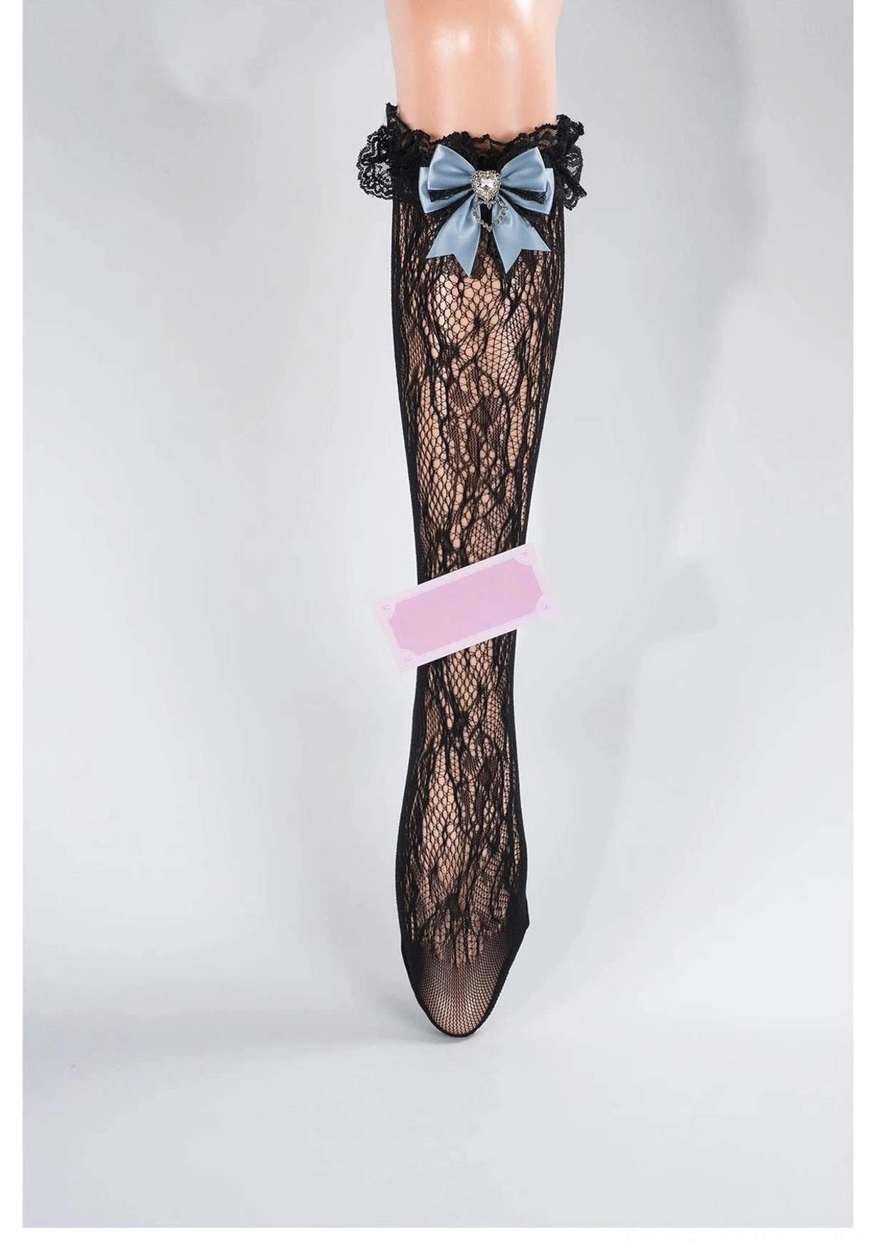 Black-blue lace mid-calf Jirai Kei socks with ruffled lace cuff, blue bow and heart rhinestone detail, floral lace pattern front view