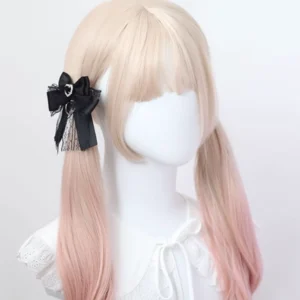 Black satin bow Jirai Kei hair clip with lace trim and heart-shaped crystal ornament, modeled on ombre twin-tail wig mannequin, side view