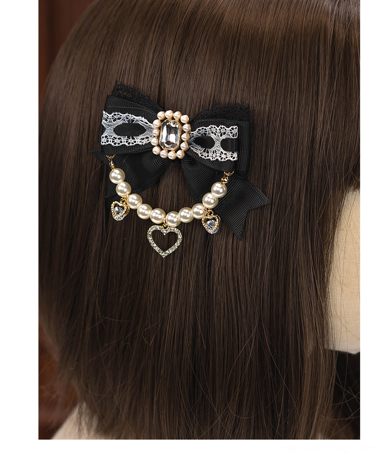 Black bow Lolita hair clip with pearl chain rhinestone heart pendant displayed on mannequin wig back view Jirai Kei aesthetic