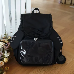 Black Jirai Kei kawaii itabag backpack with detachable bunny ears, clear acrylic display panel, and matching black mini coin purse pendant
