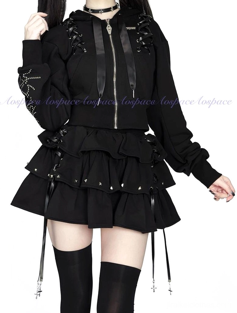 Medium close-up front view of Jirai Kei black cropped hoodie with ribbon drawstring metal zipper and tassel embellished ruffle skirt