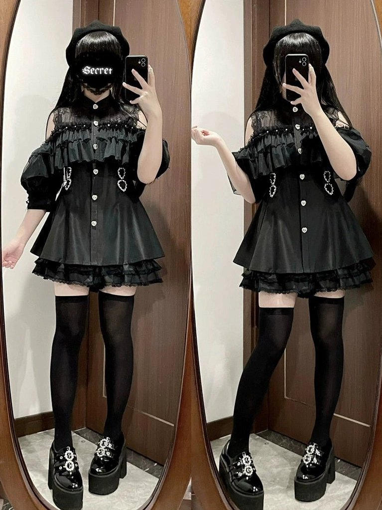 Jirai Kei black dress with fitted waist ruffle hem puff sleeves and decorative metal buckle details close-up view