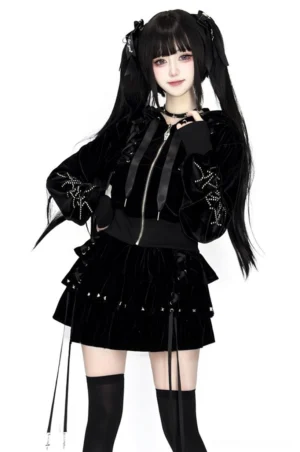 Black Jirai Kei cropped hoodie and layered ruffle skirt set with lace-up hood details worn by twin-tailed model on white background full body front view