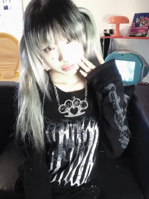 black jirai kei long sleeve graphic t-shirt upper body styling with silver stripe print heavy chain accessories female model aesthetic